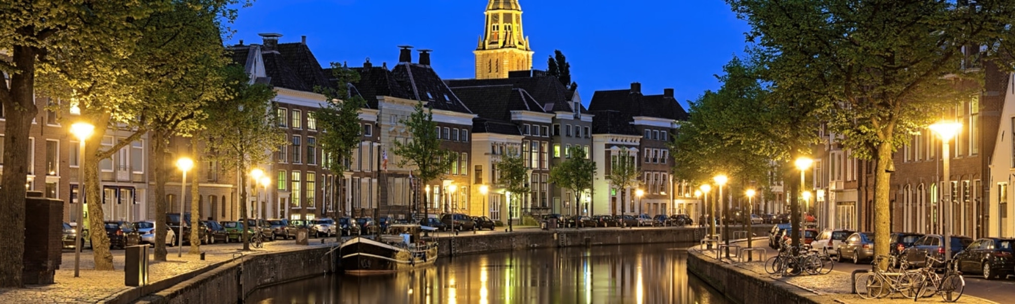 Evening view of Aa river with tower of  A-Church in Groningen, Netherlands